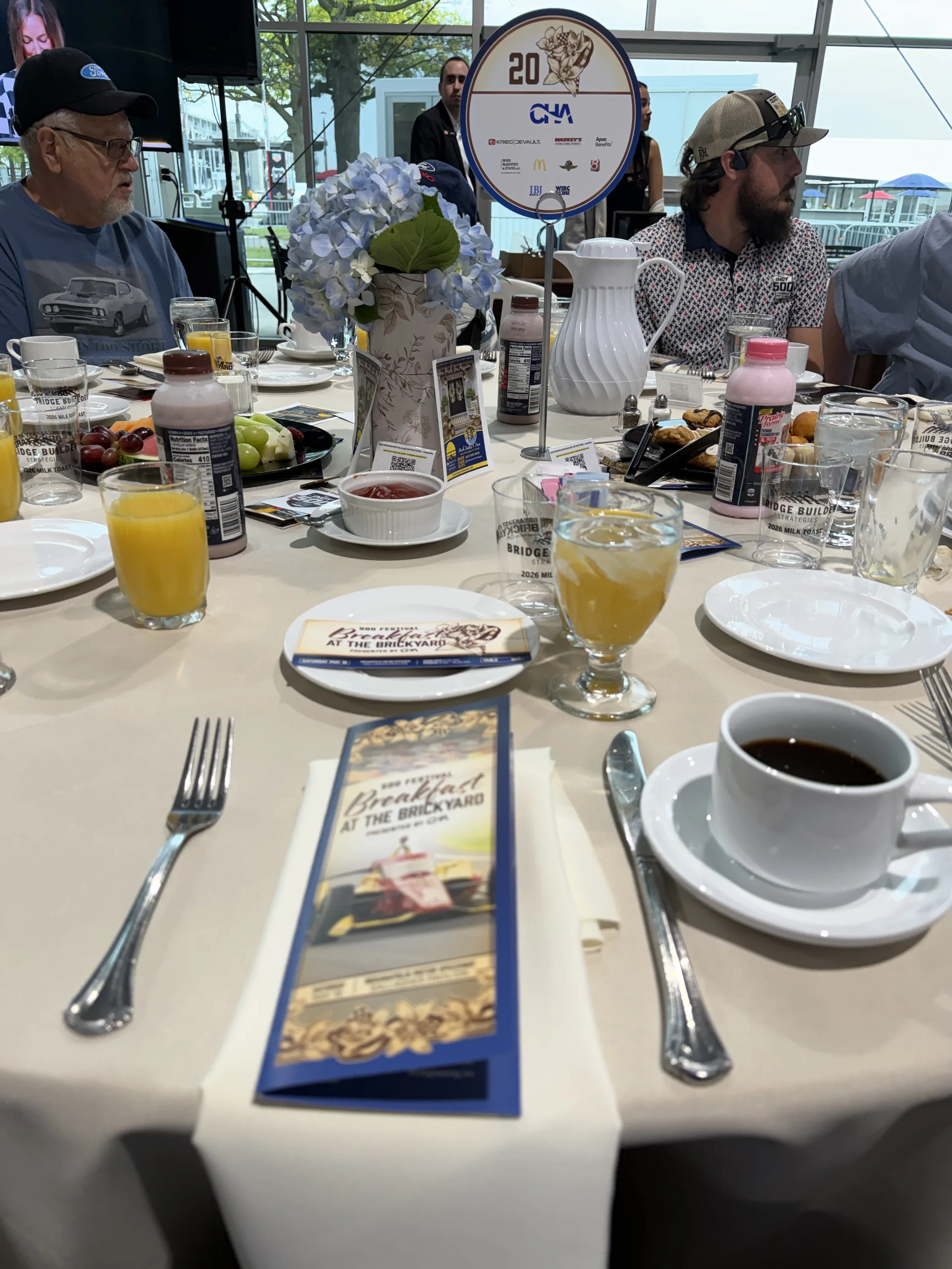 Breakfast at the Brickyard table setting with CHA centerpiece and Breakfast at the Brickyard program