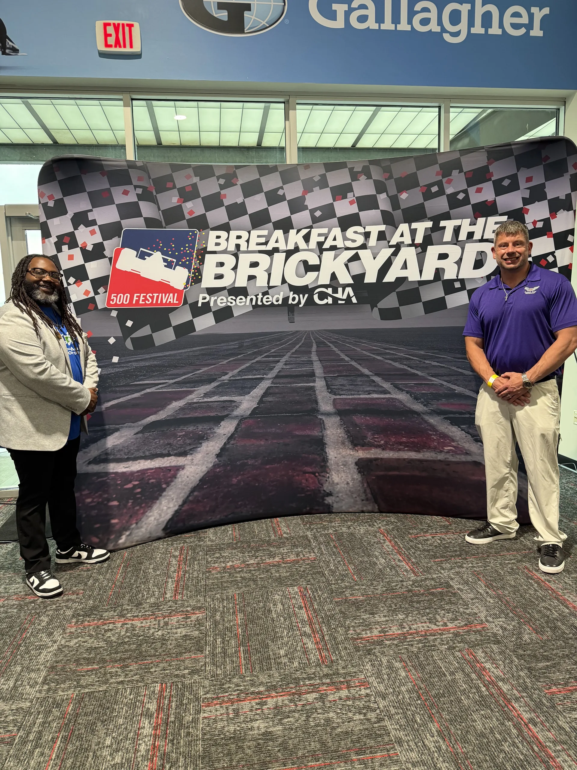 Guardian Angel team at the 500 Festival Breakfast at the Brickyard step and repeat