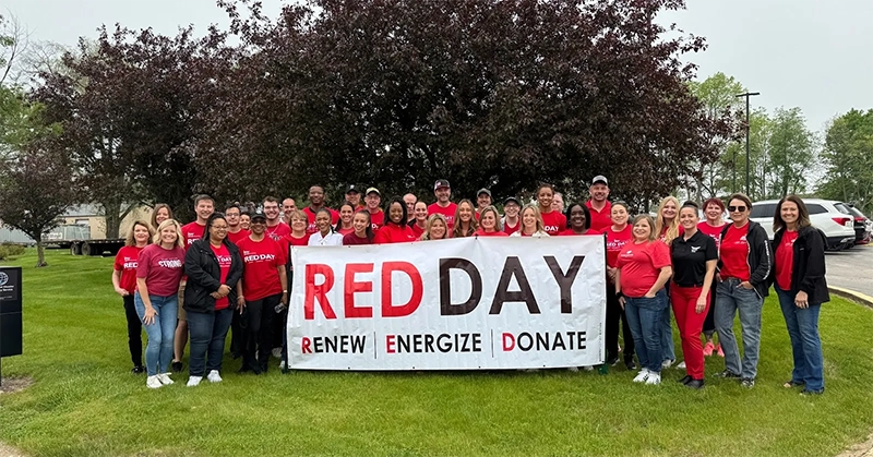 Guardian Angel team packaging meals at Keller Williams Red Day